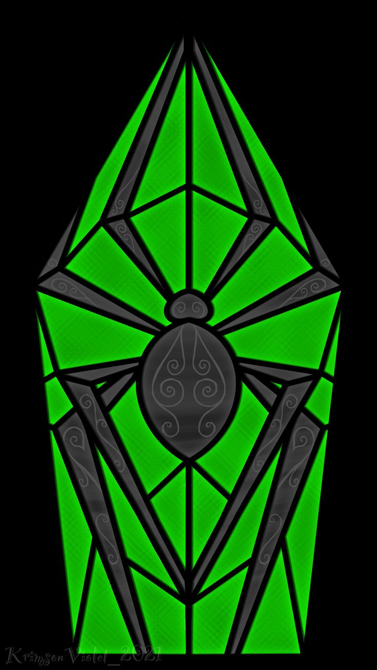 a black and green diamond with an intricate design in the center, on a dark background