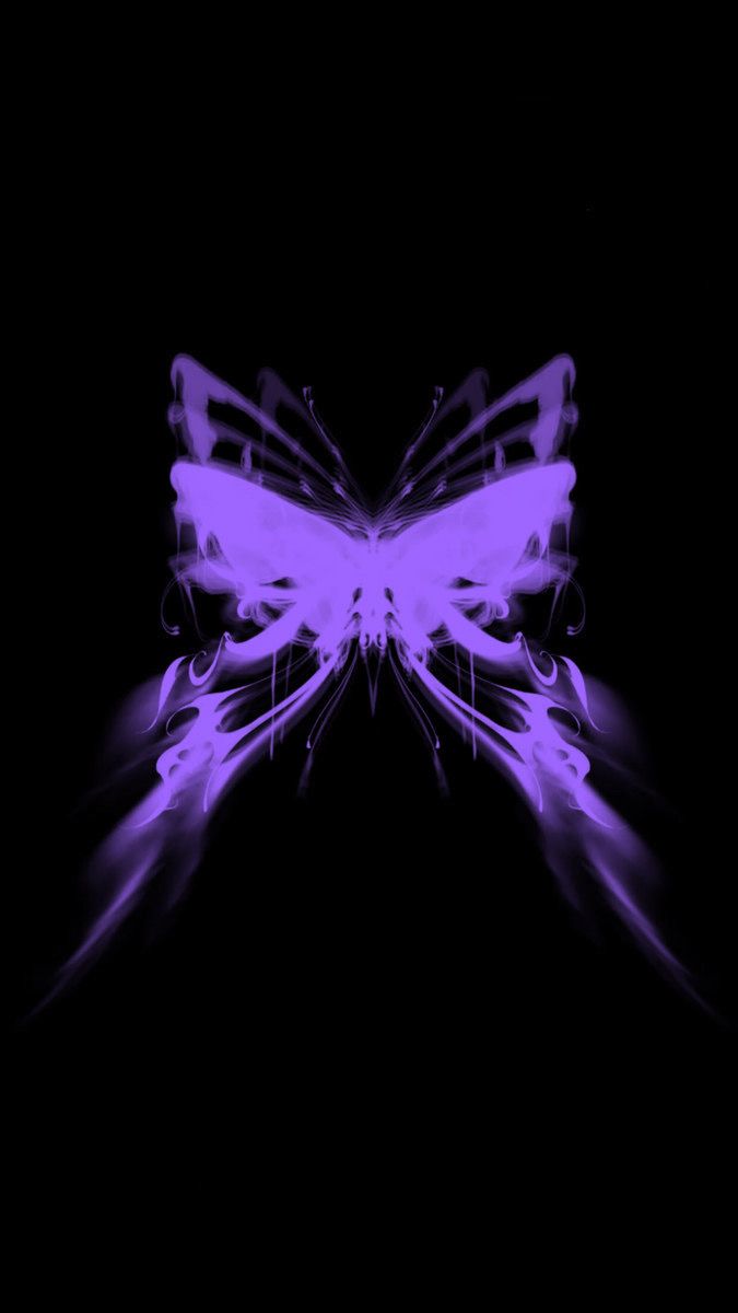 a purple butterfly is flying in the dark