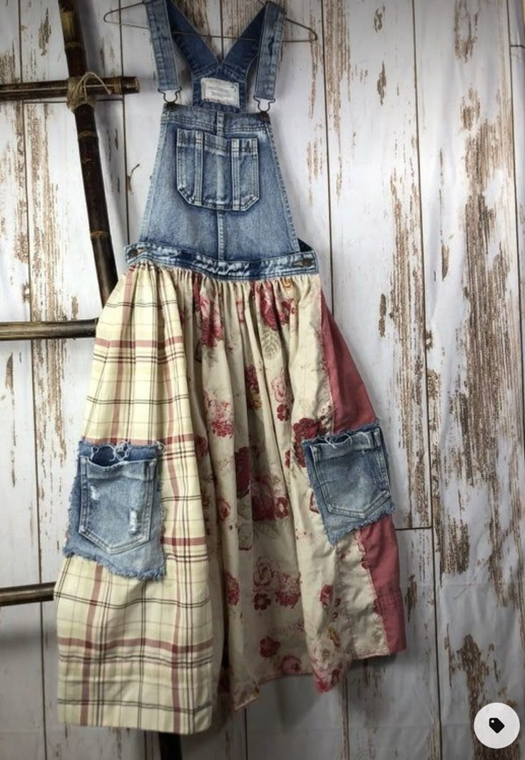 a dress made out of old jeans hanging on a wall