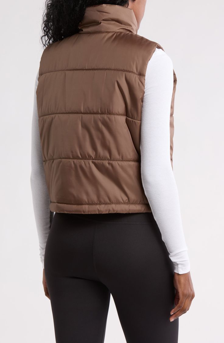 Whether you're deep in the back country or just your own backyard, you'll appreciate the core warmth of this vest filled with cozy insulation. Front zip closure Stand collar Front welt pockets Lined, with polyester fill 100% polyester Machine wash, tumble dry Imported Crop Puffer Vest, Puffer Vest, Welt Pockets, Welt Pocket, Stand Collar, Nordstrom Rack, Insulation, Puffer, Nordstrom