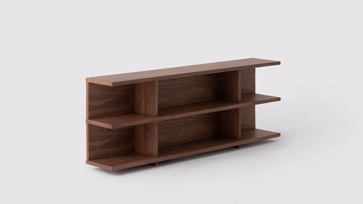 a wooden shelf sitting on top of a white floor