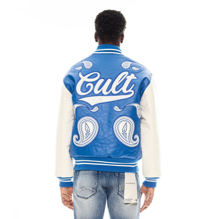 This varsity jacket silhouette with a royal blue torso and cream sleeves features classic varsity-inspired accents such as ribbed cuffs, collar, and hem. Meticulously crafted from luxurious vegan leather and elevated with a detailed paisley pattern embroidery, this unique jacket is a piece that will not only feel great but will set you apart from the crowd. - Vegan leather -Button closure -2 pockets Jacket Silhouette, Paisley Jacket, Starter Jacket, Unique Jackets, Black Men Street Fashion, Men Street Fashion, Winter Knit Hats, Pattern Embroidery, Men Street