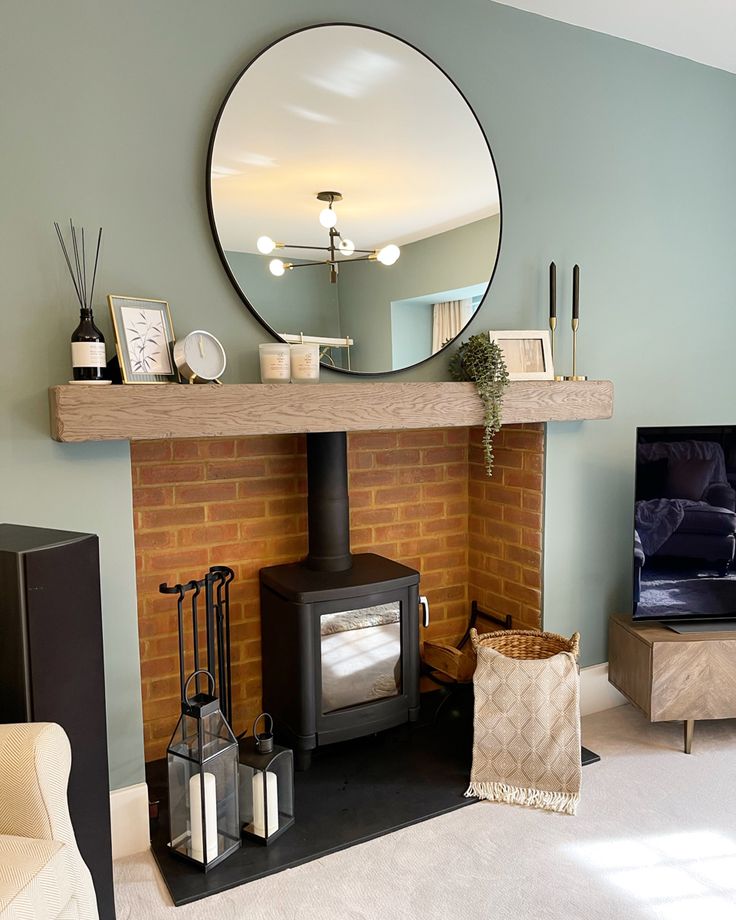 a living room with a fire place and mirror