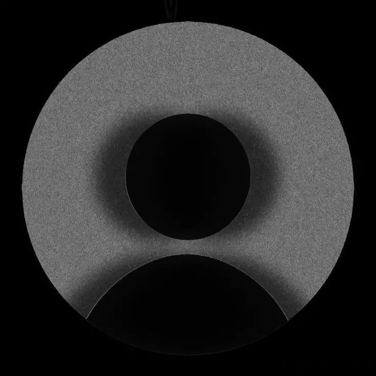 a black and white photo of a circular object with two circles on it's side