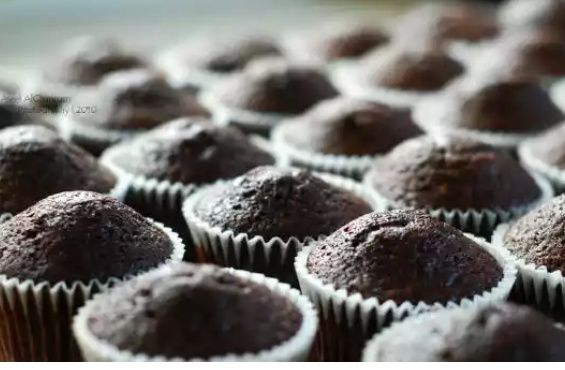 chocolate cupcakes sitting on top of each other