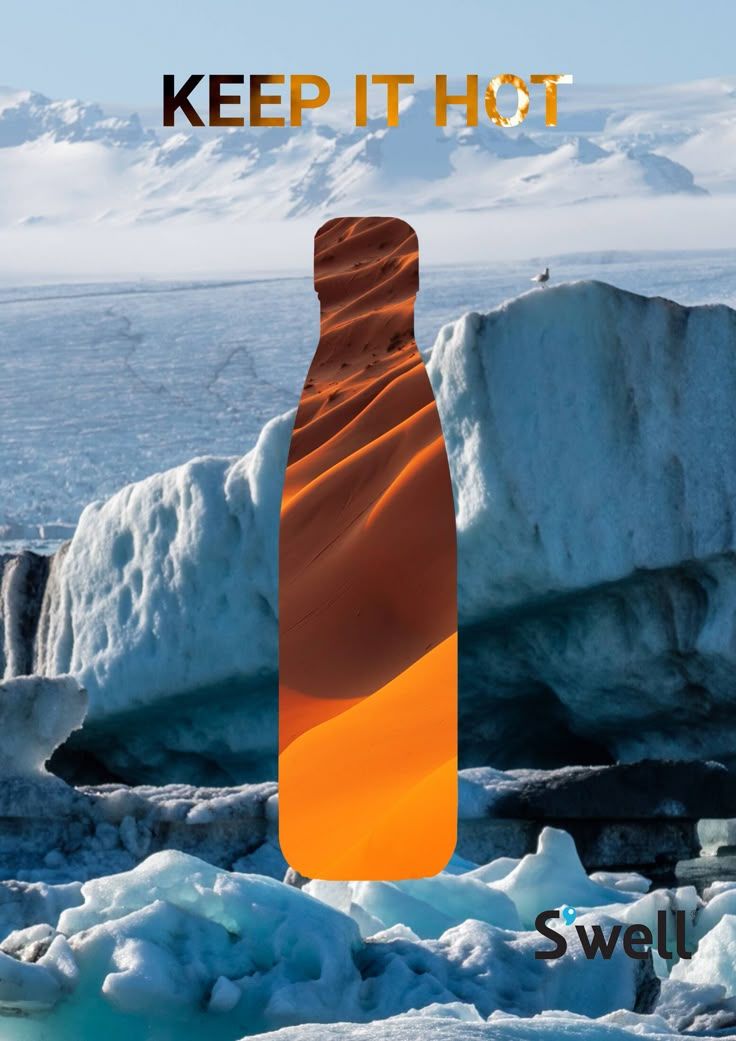 an orange bottle sitting on top of ice in front of some snow covered rocks and water