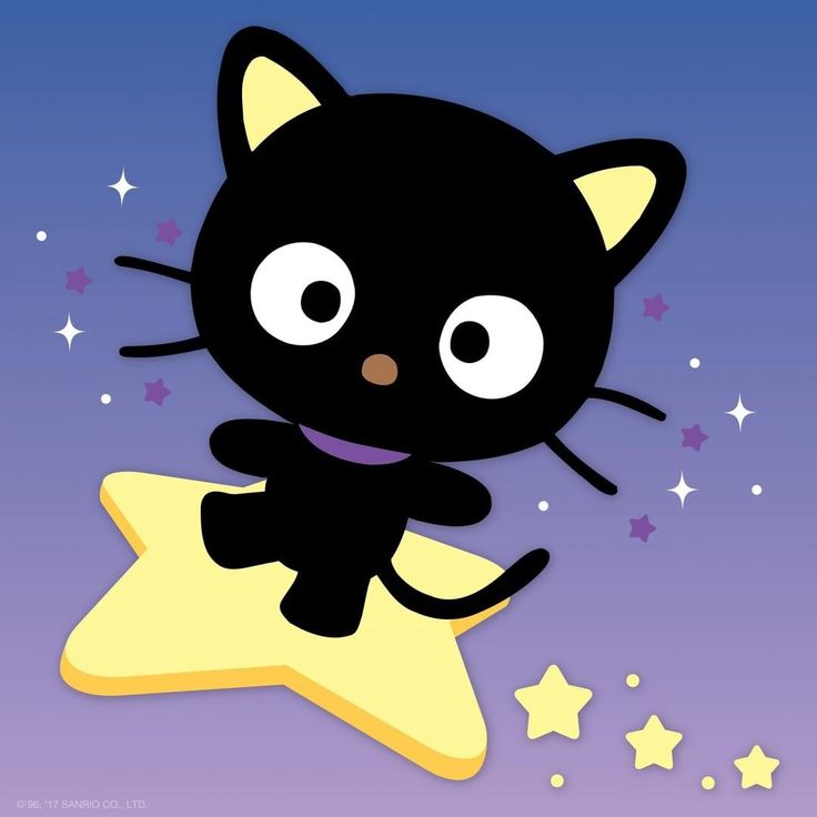 a black cat sitting on top of a star with eyes wide open and one eye closed