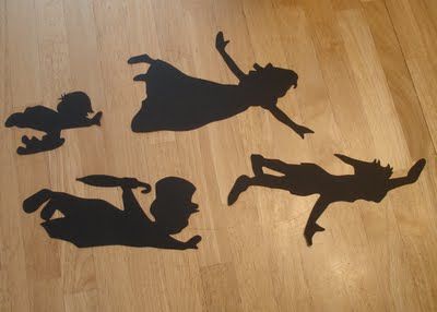 four silhouettes of people on the floor in different poses