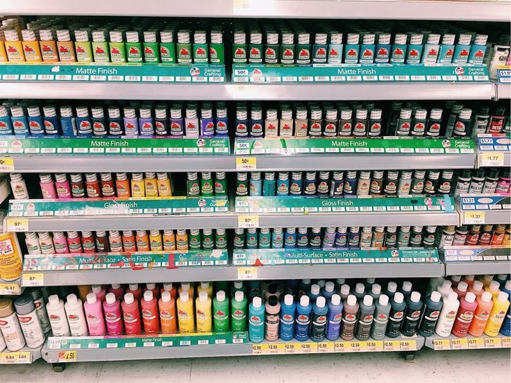 the shelves are filled with many different types of paints and condiments for sale