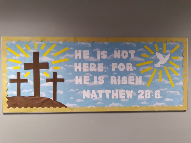 a bulletin board with the words he is not here for his risen, and two crosses