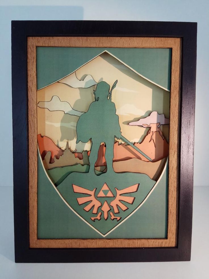 the legend of zelda paper art is displayed in a wooden frame