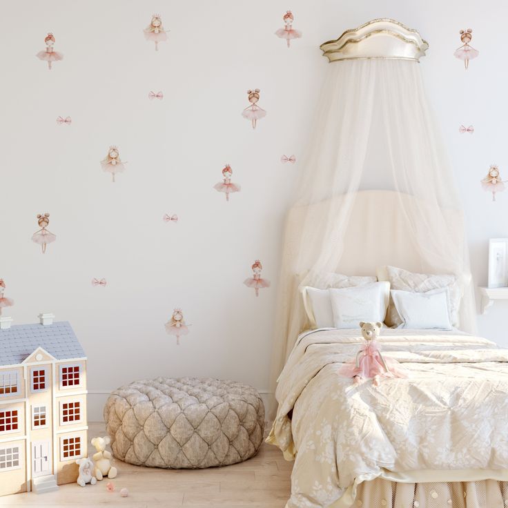 a white bed sitting next to a small doll house