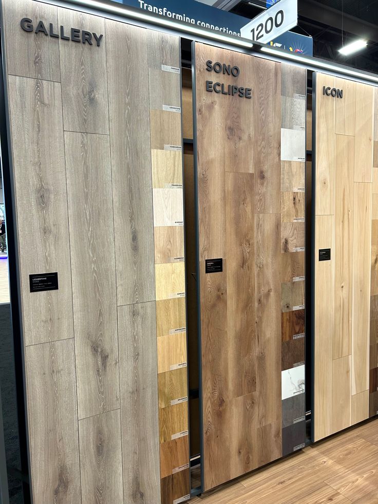 several different types of doors on display in a showroom with wooden floors and walls