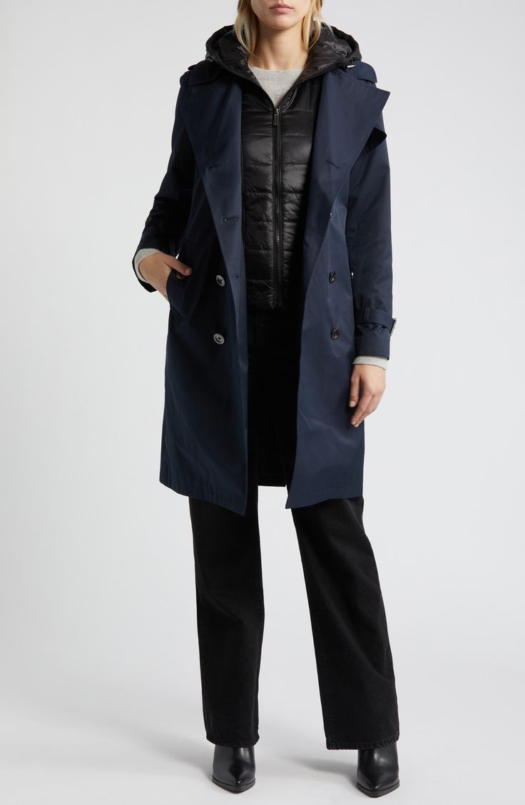 A removable hooded bib with lightweight fill adds an extra level of warmth to this cotton-blend trench in a double-breasted, belted silhouette. 38" length Double-breasted button closure Spread collar Belted cuffs Front button-flap pockets Epaulets Gun flaps Storm flap Removable belt Removable bib has front zip closure; drawcord-toggle hood; lined, with polyester fill Lined 55% cotton, 45% polyester; 100% nylon bib Machine wash, tumble dry Imported Winter Workwear Nylon Raincoat, Winter Workwear Raincoat With Detachable Hood, Fall Raincoat With Detachable Hood For Cold Weather, Winter Workwear Hooded Raincoat, Fall Cotton Raincoat With Detachable Hood, Cotton Raincoat With Detachable Hood For Fall, Weatherproof Long Coat For Workwear, Hooded Weatherproof Parka For Workwear, Fall Workwear Raincoat With Adjustable Hood