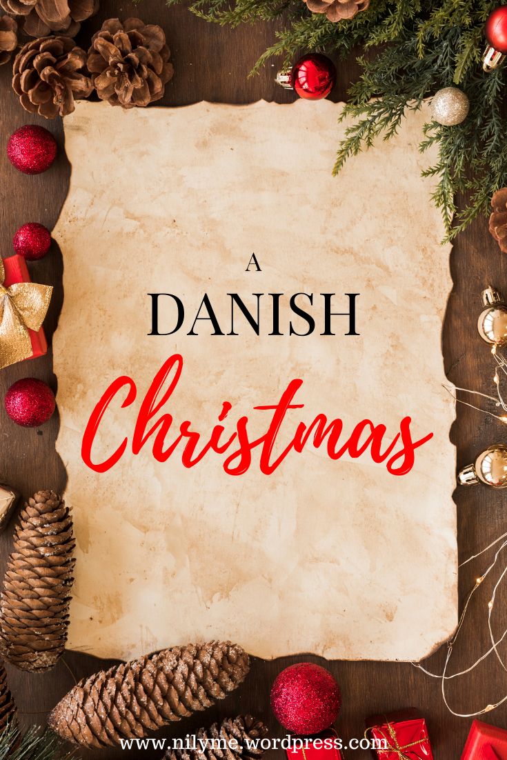 an old paper with the words danish christmas written on it surrounded by pine cones and ornaments