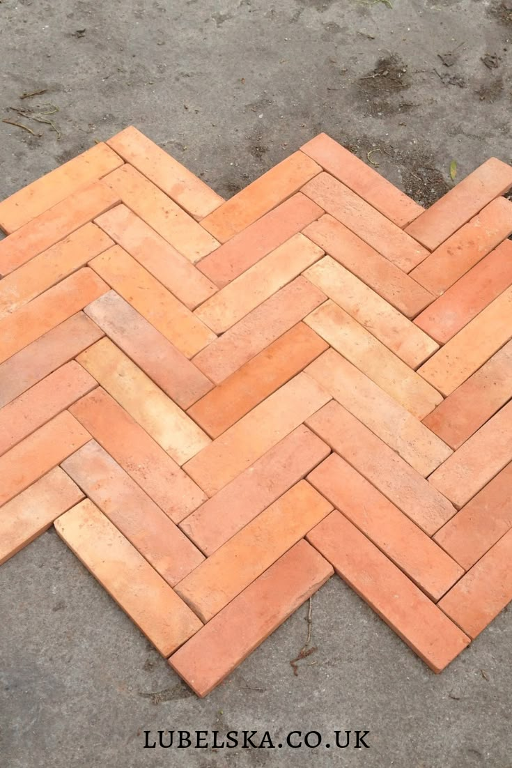 an image of a brick floor that is laying on the ground with it's diagonal pattern