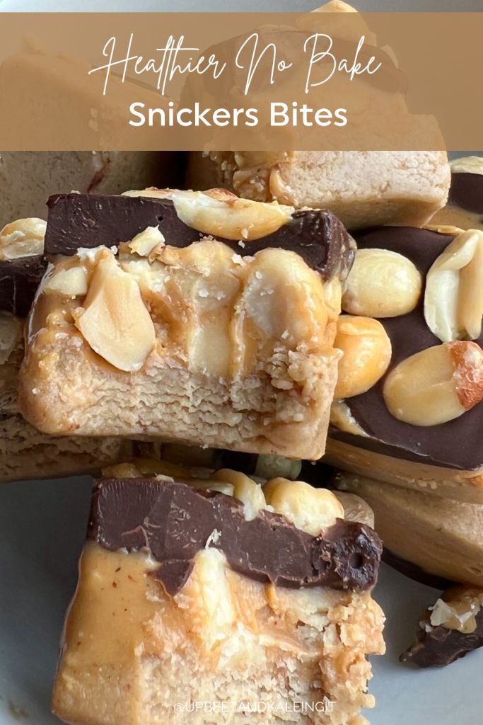 several pieces of peanut butter no bake snickkers bites stacked on top of each other