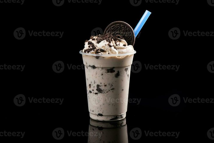 an oreo cookie milkshake with whipped cream and chocolate chips on the top