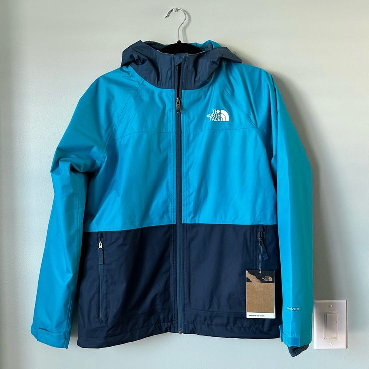 New With Tags The North Face Vortex Triclimate Jacket In Acoustic Blue Boys Size Large (12) 3-In-1 Design Combines A Waterproof Shell Jacket With A Removable, Fleece Liner Jacket-Wear Each Individually, Or Wear Them Together For The Ultimate Cold-Weather Combo Fully Seam-Sealed, Waterproof Construction Is Breathable And Shields Him From The Elements; Draft Flap With Rip-And-Stick Closure Provides Even More Protection 3-Piece, Fixed Hood And Chin Zip Guard Provide Additional Coverage Secure Zip H Navy Nylon Outerwear For Outdoor, Blue Waterproof Hooded Winter Jacket, Navy Windproof Nylon Outerwear, Navy Nylon Windproof Outerwear, Blue Nylon Winter Outerwear, Blue Sporty Nylon Outerwear, Blue Sporty Hooded Jacket For Cold Weather, Sporty Blue Hooded Jacket For Cold Weather, Blue Nylon Windbreaker For Cold Weather