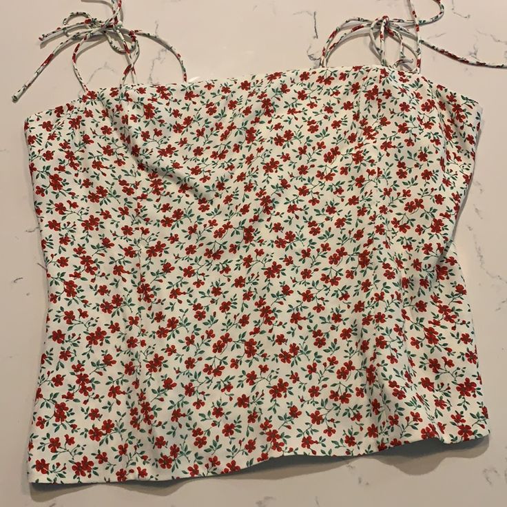 Never Worn Reformation Top With Red Floral Pattern And Adjustable Straps. Back Panel Is Fully Smocked And Strapless Bra Friendly. 53% Viscose, 47% Rayon. Casual Smocked Top With Spaghetti Straps, Red Tops With Smocked Back For Vacation, Red Smocked Top For Summer Vacation, Red Smocked Top For Spring Vacation, Red Smocked Back Top For Vacation, Red Smocked Top For Vacation In Spring, Chic Red Smocked Top For Summer, Sleeveless Smocked Top With Floral Print For Day Out, Fitted Red Smocked Top For Summer