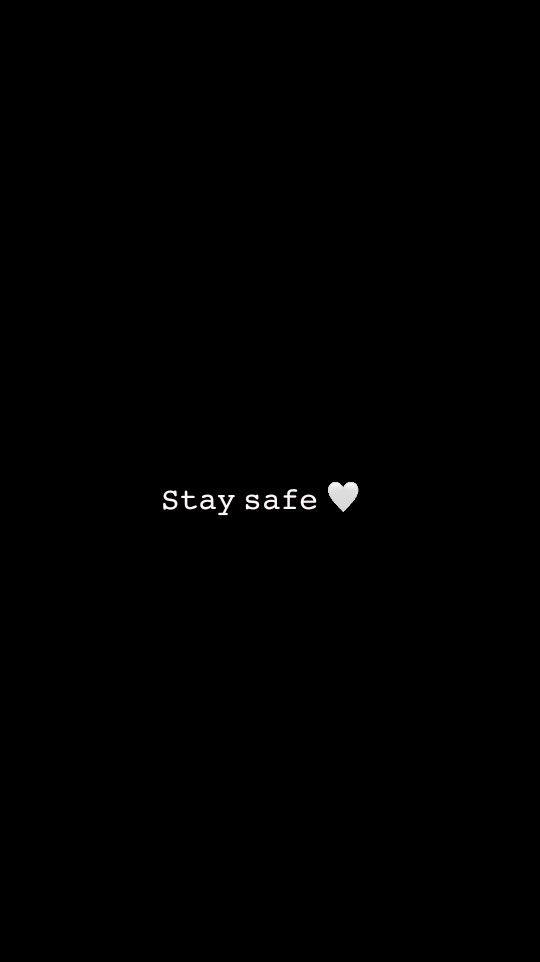 the words stay safe are written in white on a black background with a small heart