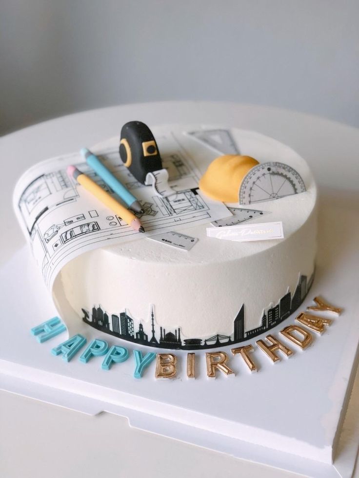 a birthday cake decorated with an image of the city and its name is happy birthday