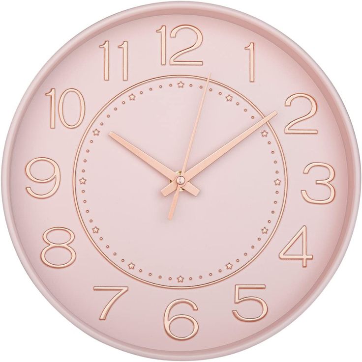 a pink wall clock with numbers on the front and back of it's face