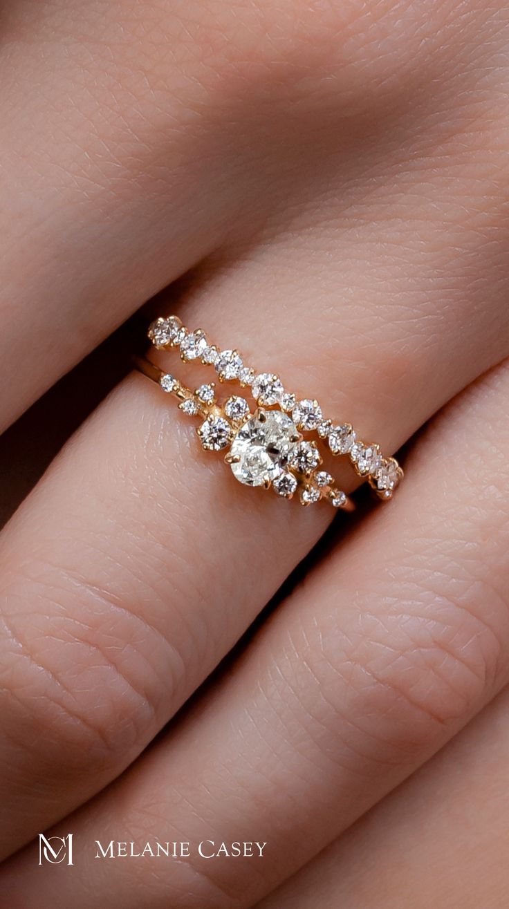 This dainty version of our Snowdrift Ring is still full of sparkle, with a 0.3ct. oval cut diamond focal accented by clusters of round diamonds on either side. Choose your metal color and carat weight to create your ideal engagement ring at melaniecasey.com! Snowdrift Engagement Ring, Snowdrift Ring, Band Drawing, Marquise Side Stones, Oval Cut Diamond Rings, Oval Cut Diamond Engagement Ring, Handcrafted Engagement Ring, Melanie Casey, Winter Window