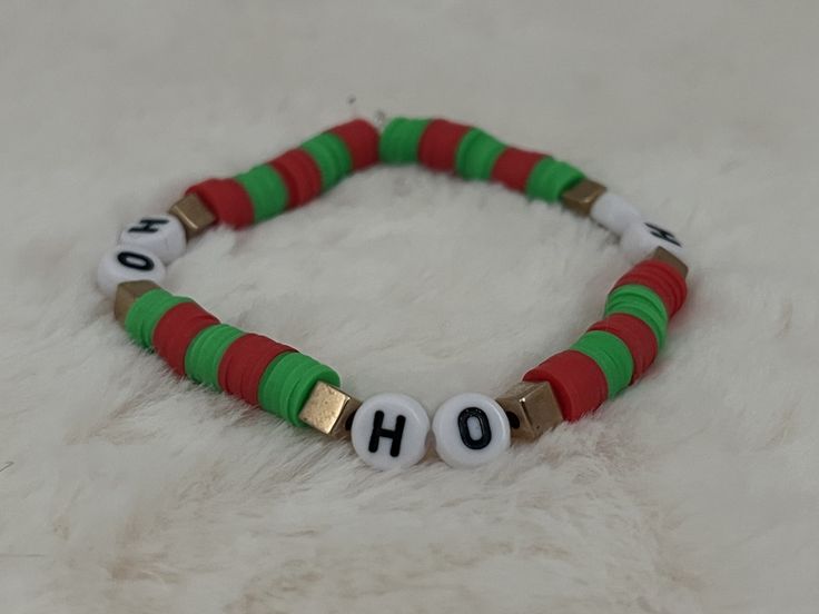 🎄 A handmade Christmas themed bracelet, a perfect children's gift for Christmas! 🎅 Handmade Multicolor Bracelets For Holidays, Festive Adjustable Personalized Bracelets, Handmade Green Beaded Bracelets For Holidays, Adjustable Green Beaded Bracelets For Holiday, Multicolor Christmas Gift Bracelets, Novelty Handmade Bracelet As Gift, Holiday Gift Charm Bracelet Adjustable, Novelty Handmade Bracelets For Gifts, Handmade Novelty Bracelets For Gift