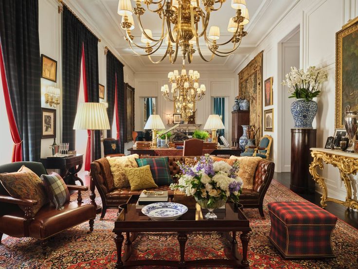 a living room filled with furniture and a chandelier