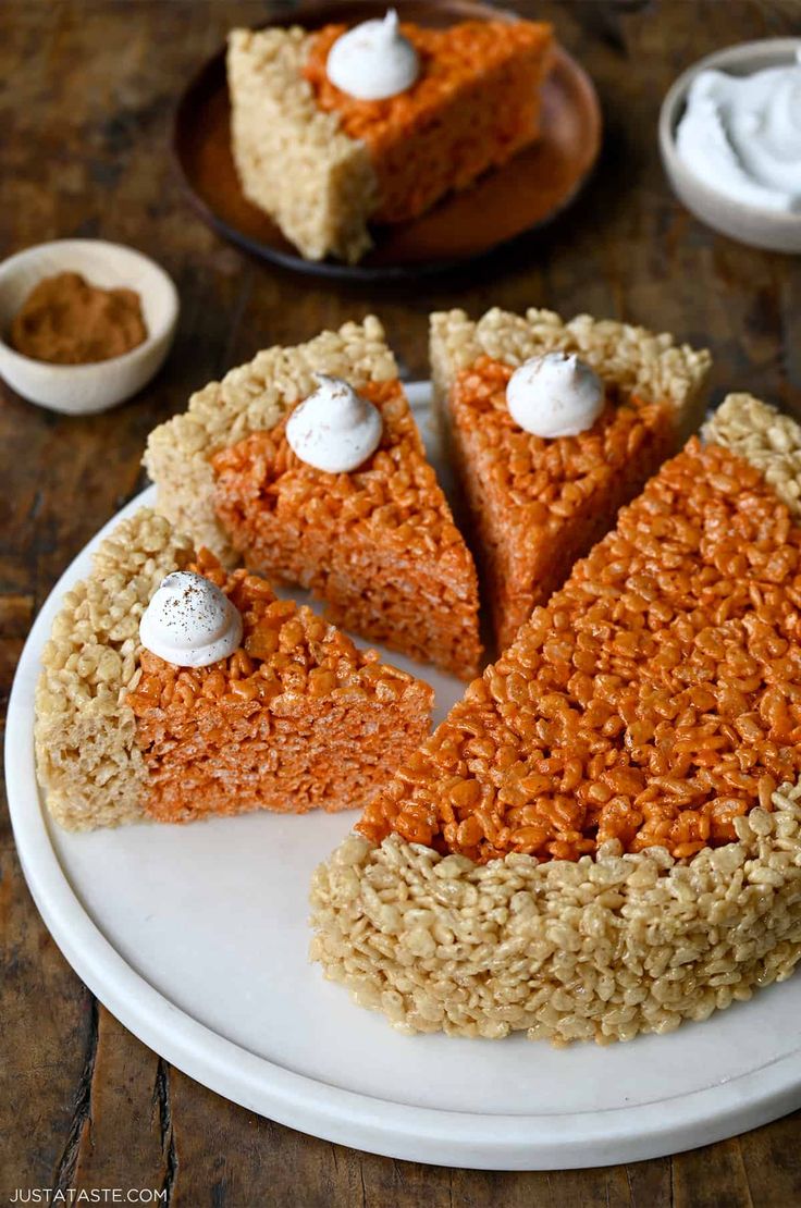 some kind of rice krispy kreme cake on a plate with two slices cut out