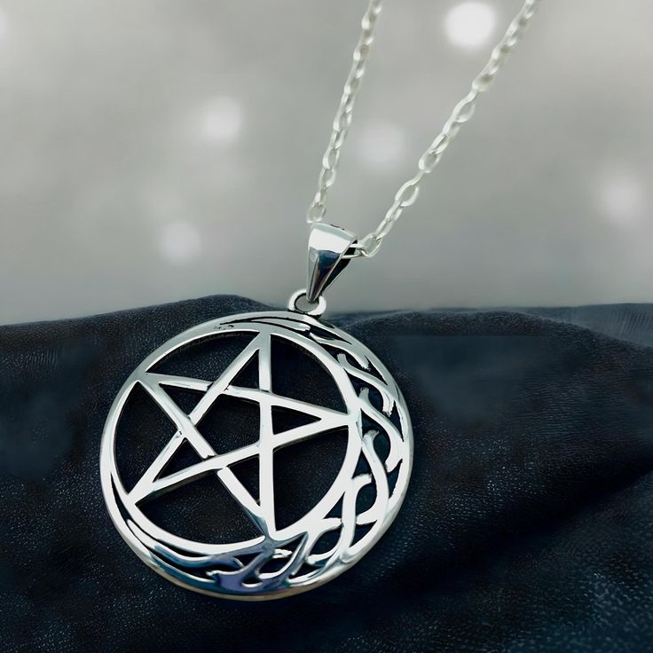 Dive into the celestial enchantment with our handcrafted Celtic Moon & Star Pendant, expertly crafted from the finest 925 Solid Sterling Silver! This exquisite piece is more than just jewelry; it's a miniature masterpiece that captures the mystique of the night. Each pendant, stamped with 925, measures approximately .91 x .91 inches, embodying the perfect blend of ancient symbolism and modern artistry. Complete your look with the optional 18" sterling silver cable link chain, and wear the night sky's allure close to your heart! Satisfaction Guaranteed! Moon Star Pendant, Celtic Moon, Celestial Necklace, Moon Star, Star Pendant, Stars And Moon, Link Chain, Favorite Jewelry, Jewelry Necklace Pendant