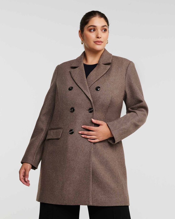 This gorgeous brown overcoat is the perfect way to stay warm and stylish! It is crafted from a luxurious wool-cashmere blend with velvet lapels and elegant flap pockets - what more could you want? Stay cozy this season in style! This plus size peacoat is perfect with a party dress and your favorite bootcut jeans, too Estelle Redford Coat | MOCHA | Jackets | Materials & Care Instructions: ['50% Polyester', 'Machine wash cold', 'Imported'] Brown Double Button Closure Pea Coat For Winter, Winter Brown Pea Coat With Double Button Closure, Brown Double Button Pea Coat For Winter, Brown Winter Pea Coat With Double Button Closure, Elegant Brown Outerwear For Cold Weather, Notch Lapel Brown Pea Coat For Fall, Brown Pea Coat With Notch Lapel For Fall, Brown Notch Lapel Pea Coat For Office, Brown Notch Lapel Pea Coat For Fall