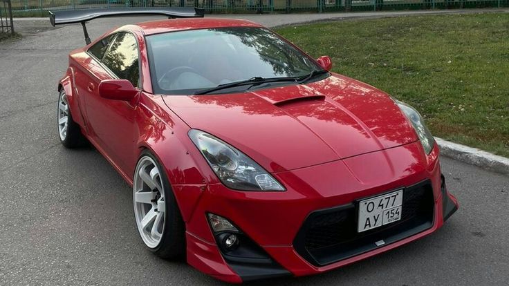 a red sports car parked on the street