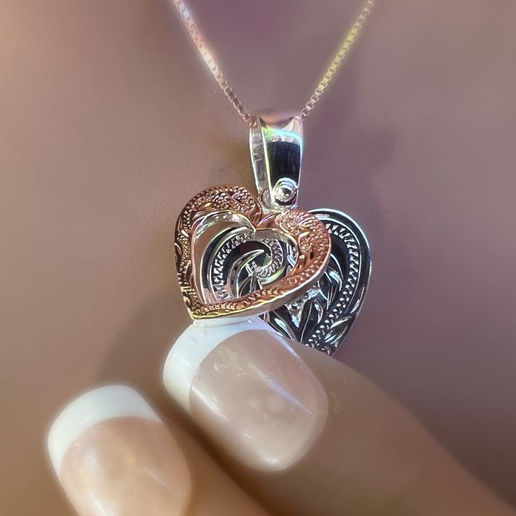 Two hearts that beat as one!! A Rose Gold Scroll Heart sits on top of a Silver Scroll Heart. This romantic design sends a message of love for Valentine’s Day or any special occasion! Two Tone jewelry is on trend. Accented with a cubic zirconia centered in the middle of both hearts, the added sparkle is a nice surprise. Two hearts! Rose Gold Scroll Heart sits on top of a Silver Scroll Heart. Romantic design Sparkling Cubic Zirconia in center of both hearts! Includes 18 inch adjustable chain. Fine Jewelry Double Heart Necklace For Wedding, Double Heart Diamond Jewelry Gift, Intricate Rose Gold Sterling Silver Jewelry, Rose Gold Engraved Heart Pendant Jewelry, Engraved Rose Gold Heart Pendant Jewelry, Engraved Rose Gold Heart Pendant, Rose Gold Heart Cut Necklace For Wedding, Rose Gold Jewelry For Valentine's Day Anniversary, Rose Gold Jewelry With Intricate Design For Gift