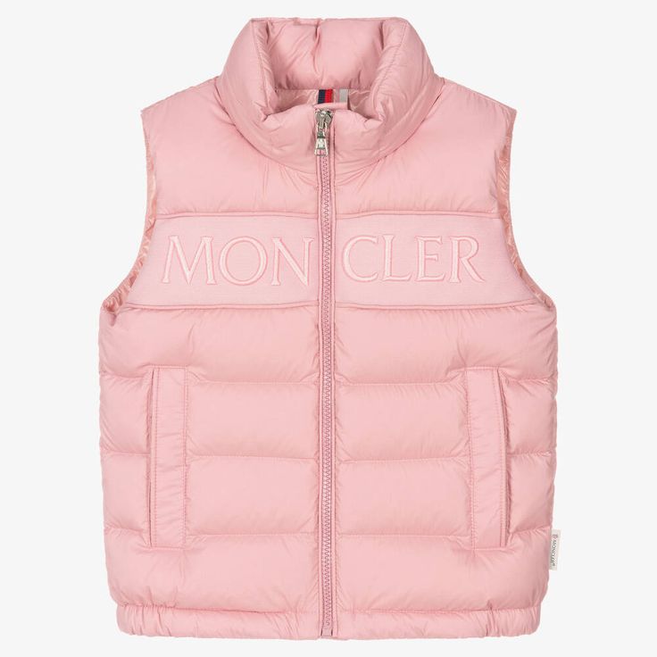 A pale pink puffer gilet for girls by Moncler Enfant, padded with warm and luxurious down. Water repellent, it is made in silky soft and lightweight fabric in a matt finish. There is a logo tab on the side seam, a branded front zip fastening and useful popper-closing pockets. The label's pink branding is embroidered across the front panel for instant designer awareness. It has a pack-away hood for added protection from wet weather. Coquette Stuff, Pink Branding, Puffer Gilet, Wealthy Lifestyle, Designer Coats, Fit Board Workouts, Water Repellent Fabric, Coat Design, Wet Weather