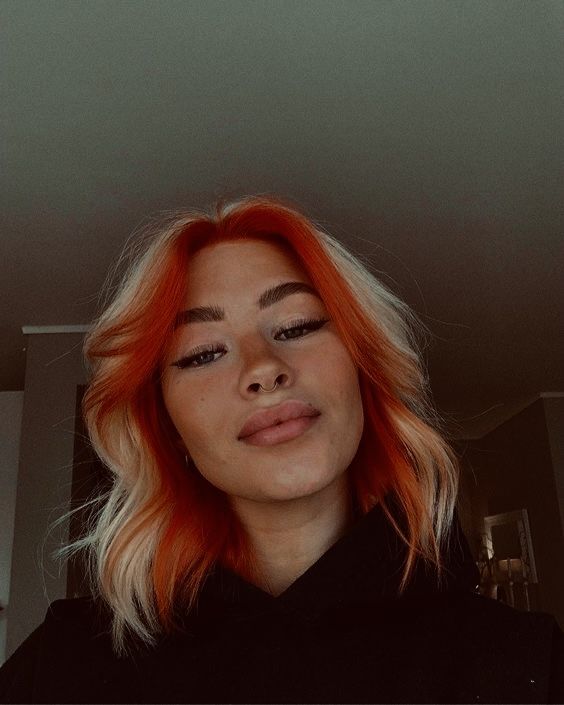 White And Colored Hair, Hair Dyed Underneath And Front Strands, Half Orange Half Blonde Hair, Dual Colored Hair, Blond And Orange Hair, Copper And Blonde Hair Split, Front Of Hair Dyed, Neon Hair Colour, Half Ginger Half Blonde Hair