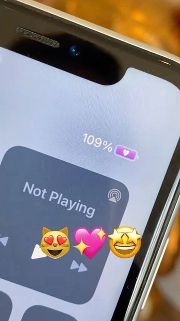 someone is holding their phone with emoticions on the screen that say not playing