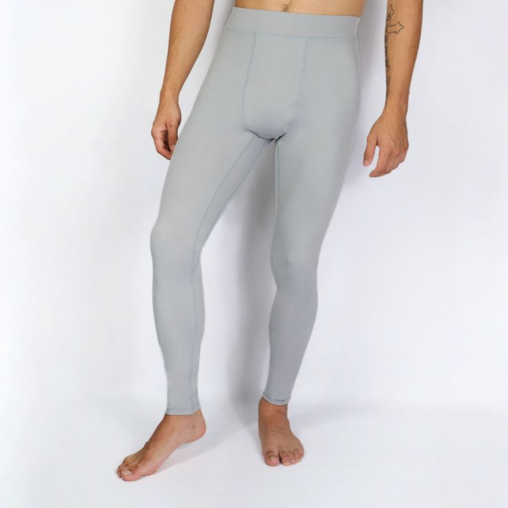 For those who demand more from every move. Designed to not just keep up, but to amplify your journey as an athlete. Featuring an athletic fit, superior durability, enhanced muscle support and performance. EXOSKLTN Men's ExoPro Sport leggings in Cool Grey. Product Benefits: Unmatched Durability: EXOSKLTN leggings are rip-proof and anti-pilling, designed to withstand intense training sessions. The reinforced stitching ensures the leggings withstand regular wear and tear. Perfect Second-Skin Fit: E Functional Compression Activewear In Solid Color, Gray Breathable Activewear With 4-way Stretch, Gray Breathable 4-way Stretch Activewear, Squat Proof Solid Activewear With 4-way Stretch, Solid 4-way Stretch Squat Proof Activewear, Solid Sporty Squat Proof Tights, Solid Color Compression Activewear, Sweat Resistant, Gray 4-way Stretch Moisture-wicking Activewear, Gray Moisture-wicking Activewear With 4-way Stretch