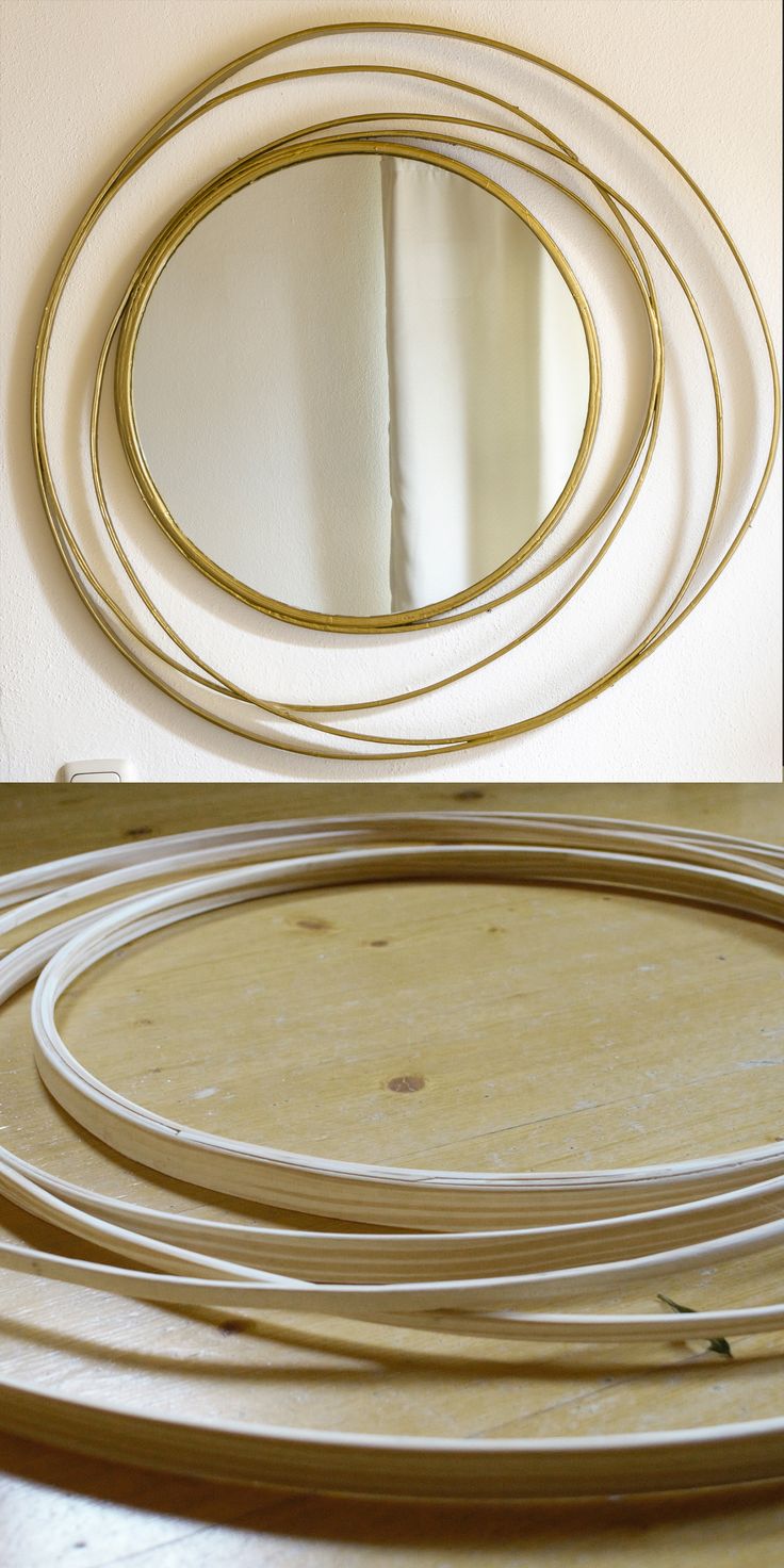 three circular mirrors sitting on top of a wooden table