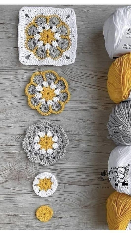 several crocheted grannys are arranged on a table