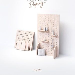 two wooden pegboard displays on a white background with the words, woodworking designing