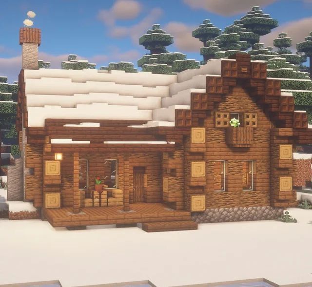 a house made out of wood in the snow