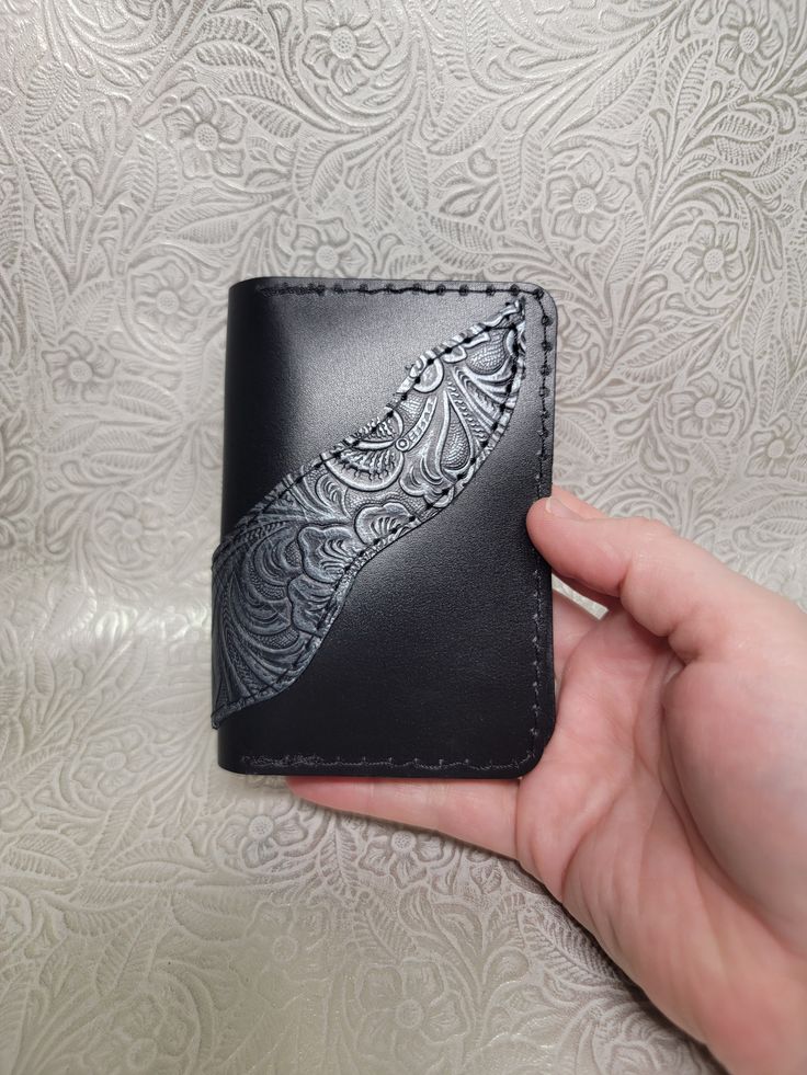 These beautiful handmade leather wallets are unique pieces that can add style to your purse or pocket.  The bifold wallets have 4 card pockets and 2 inside pockets, great for cards, receipts, or cash. Approximately 3 ¾ x 4 ¾ x ½ inch thick.  Thickness will vary slightly as each one is cut independently and leather thickness varies. Thank you for considering purchasing with our small business.  We make each item with care because we love what we do.  As with all leather, colors may vary slightly and there may be unique marks due to branding and animal scars. We try to avoid these but occasionally they are used as they make a piece unique.  If you have any questions or specific requests, please reach out.  We are always trying to expand with new ideas.  Other handmade leather items will be a Black Wallet With Coin Pocket For Personal Use, Black Leather Wallet Hand-stitched, Hand-stitched Black Leather Wallet, Black Bifold Card Holder For Personal Use, Black Bifold Coin Purse With Card Slots, Black Handmade Card Holder For Daily Use, Handmade Black Leather Coin Purse, Black Trifold Wallet With Card Slots, Black Leather Handmade Coin Purse