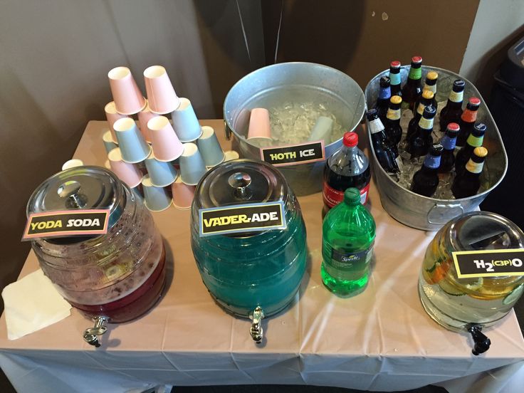 various bottles and containers with labels on them sitting on a table next to other items