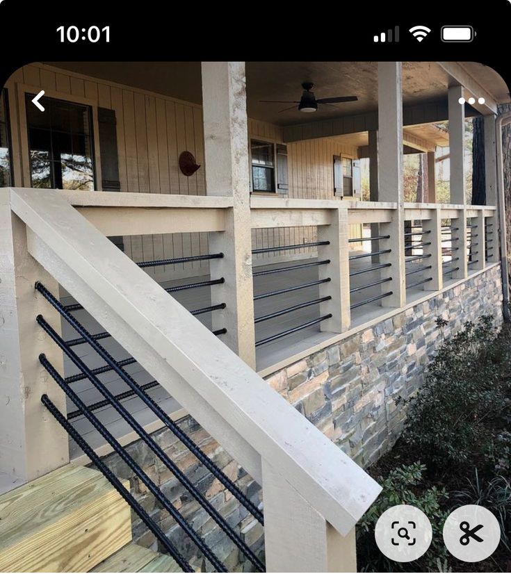 an image of a house with stairs and railings