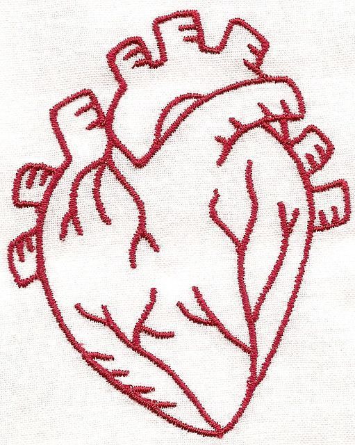 an embroidered heart is shown on a white shirt