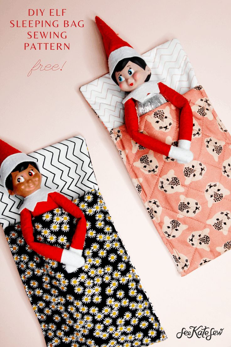 an elf laying on top of a bed next to a sleeping bag with a doll in it