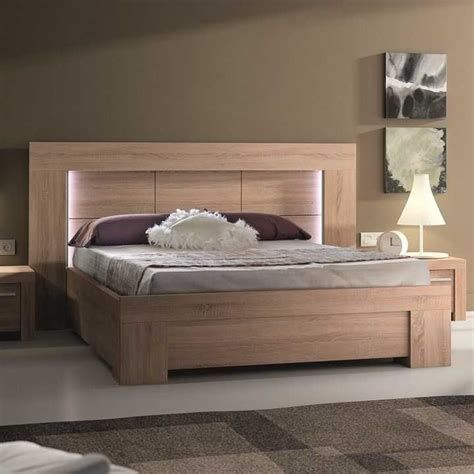 a bedroom with a bed, nightstands and two night stands on the floor next to each other