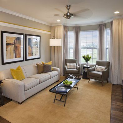 a living room filled with furniture and a flat screen tv